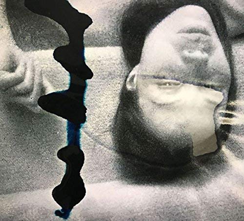 Black and white portrait of two people with blue paint streak.
