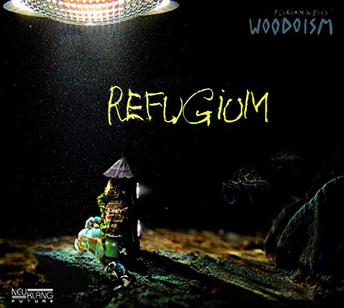 CD cover: miniature, moss-covered structure under a bright spotlight.
