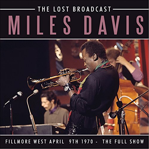 Miles Davis playing trumpet on stage with band members, CD cover.