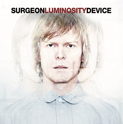 Album cover: Portrait of a man with blurred, ghostly figures behind him.