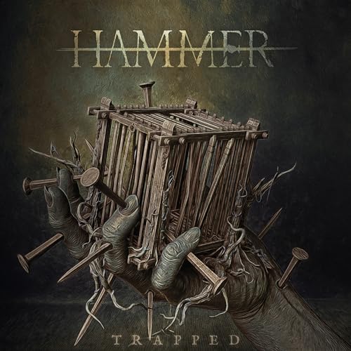 CD case for Hammer's "Trapped" album, dark cover, likely featuring the artist.