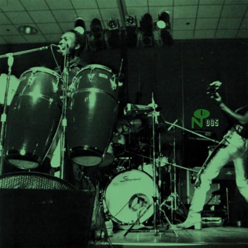 Vintage stage photo of musicians with drums and congas, green tint.
