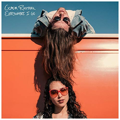 Album cover featuring two people with sunglasses, one upside down.