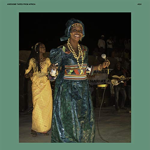 CD cover featuring a smiling woman in traditional clothing performing onstage.