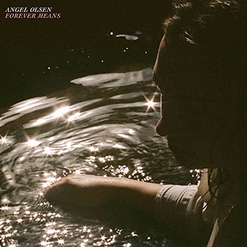 Angel Olsen album cover: woman’s profile by shimmering, dark water.
