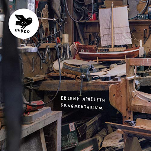 CD cover with a workshop scene, a model boat, and text "Fragmentarium".