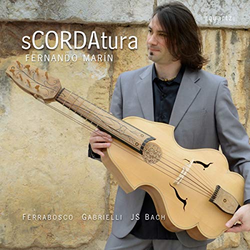 Fernando Marin holds a unique, violin-shaped guitar on the CD cover.