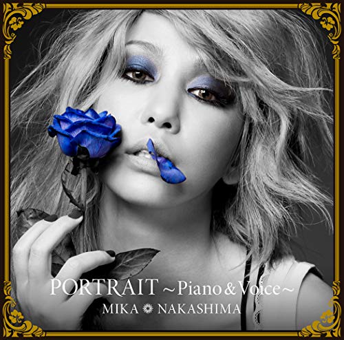 Black and white portrait of Mika Nakashima holding a blue rose.