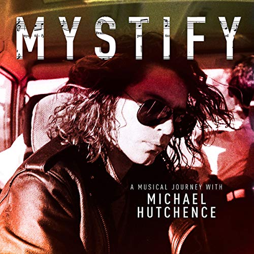 Album cover for “Mystify” featuring Michael Hutchence in a car.