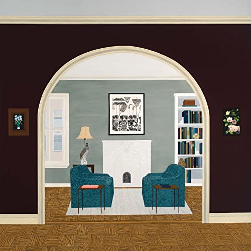 Archway framing a room with furniture, a fireplace, and artwork.