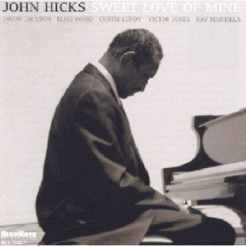 John Hicks CD cover featuring a black and white portrait of a pianist.