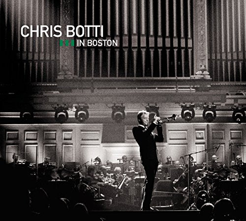 Chris Botti playing trumpet on stage with orchestra, black and white.