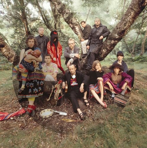 Group portrait of Current 93 members in a forest setting.