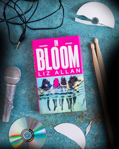 Book cover with musical items—microphone, drumsticks, CD—on a teal surface.