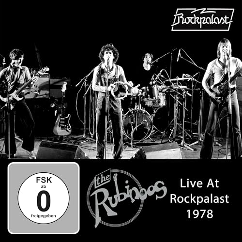Black and white photo of The Rubinoos performing live on stage in 1978.