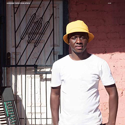 CD cover featuring a young man in a yellow hat, standing outdoors.