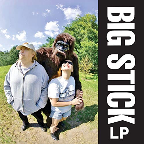 Album cover: two people with a large gorilla in a field.