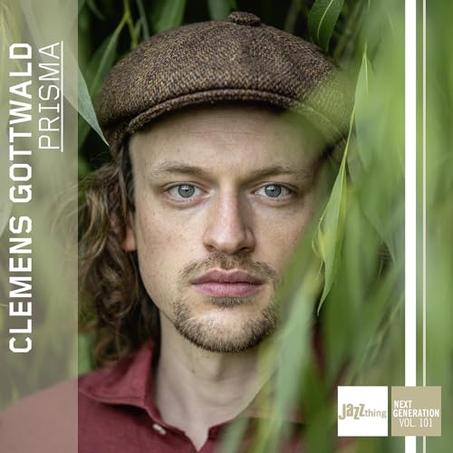 CD cover featuring a young man with a cap, titled "Prisma.