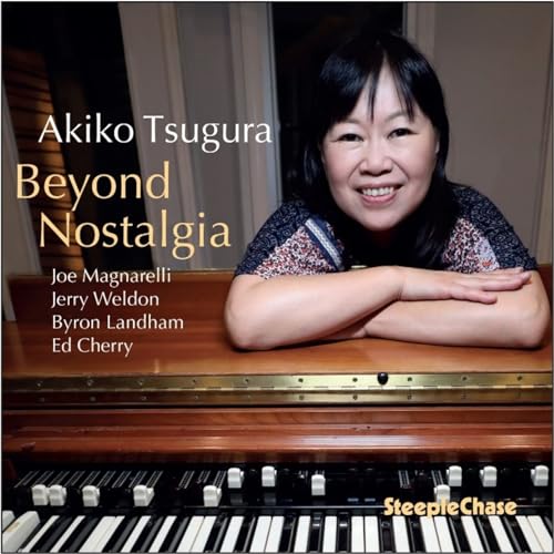 Akiko Tsuruga CD cover featuring a smiling woman with a piano.