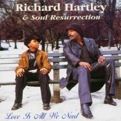 CD cover featuring two men sitting on a park bench in winter.