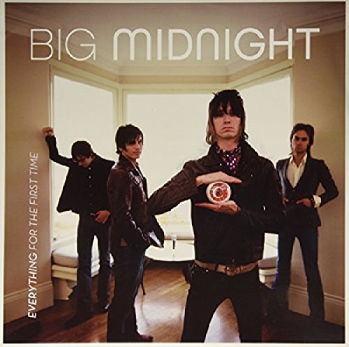 Album cover featuring four men in suits posing in a room.