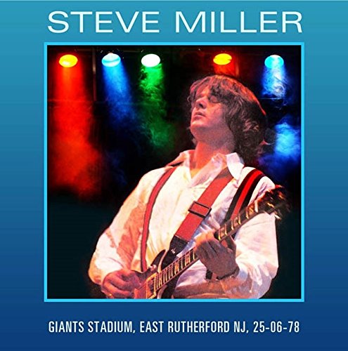 Steve Miller playing guitar onstage, with stadium details below.