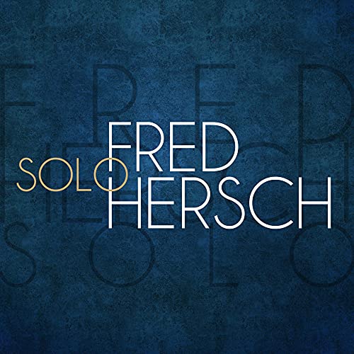 Album cover for Fred Hersch’s “Solo” with gold and white text on blue.