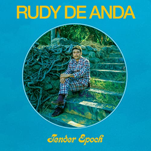 CD cover: man sitting on stone steps in a green, circular frame.