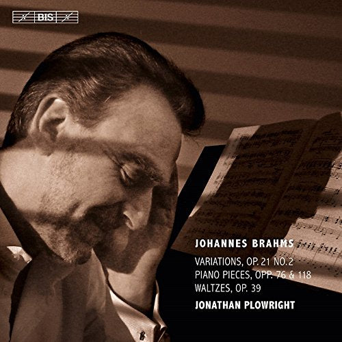 Sepia-toned CD cover featuring pianist Jonathan Plowright looking at sheet music.