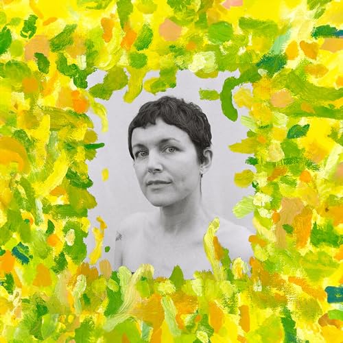 Black and white portrait of a woman framed by green and yellow paint.