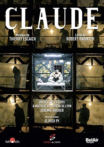 Claude" DVD cover: a man in a cage on a stage, silhouetted figures.