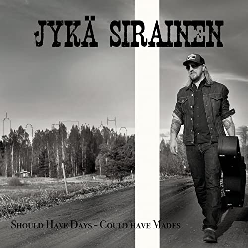 Black and white album cover featuring a man with a guitar case.