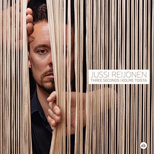 Man partially obscured by vertical wooden slats, album cover for Jussi Reijonen.
