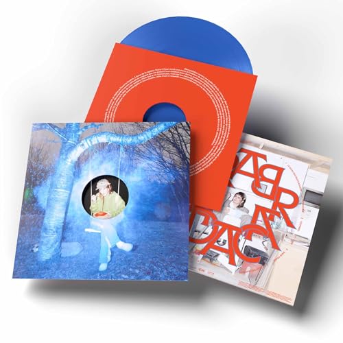 Vinyl record with red and blue cover art featuring a person on a swing.