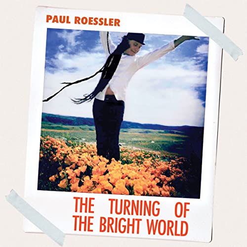 CD cover: woman with long hair in a field of orange flowers.