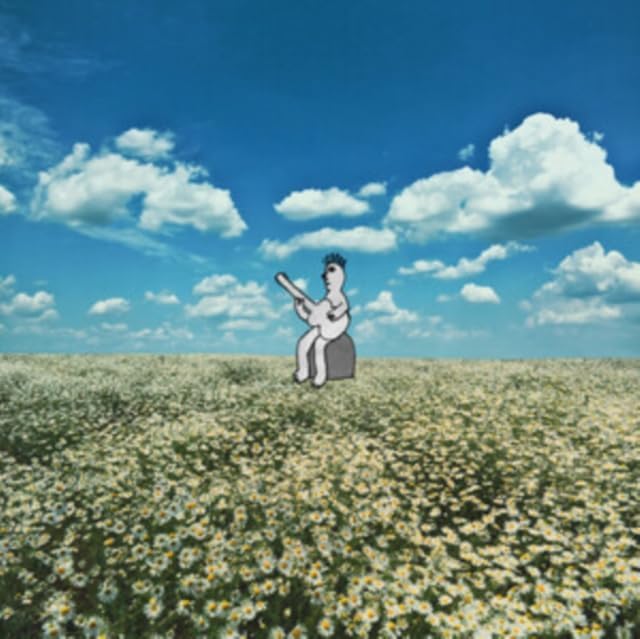 Sad clown figure sits in a field of white flowers under a blue sky.