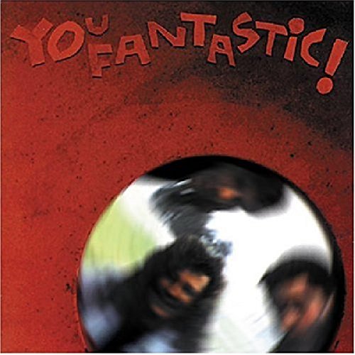 Red album cover with a circular window showing blurred faces.