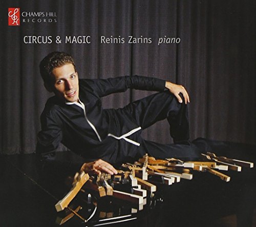 CD cover featuring pianist Reinis Zarins with a xylophone on a piano.