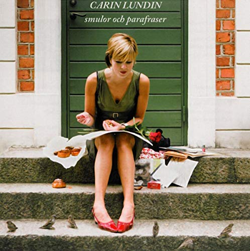 CD cover: woman in green dress seated on steps with pastries and roses.
