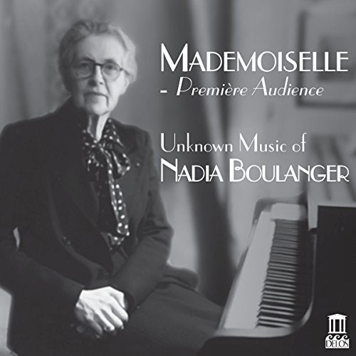 Black and white portrait of Nadia Boulanger seated at a piano.