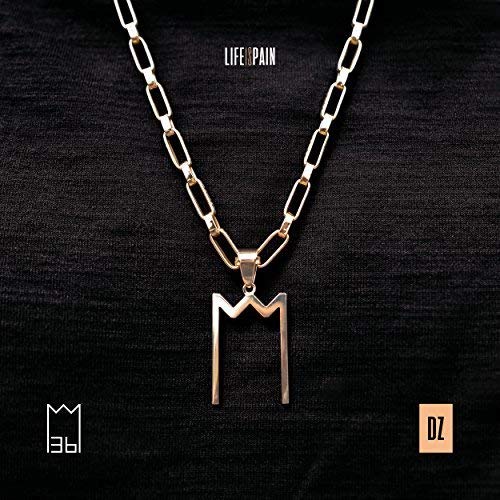 Gold chain necklace with a stylized "M" pendant on a black background.