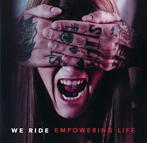 Woman with mouth open, eyes covered by tattooed hands.