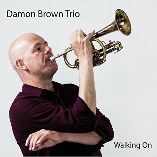 CD cover: Damon Brown playing a trumpet, album title "Walking On".