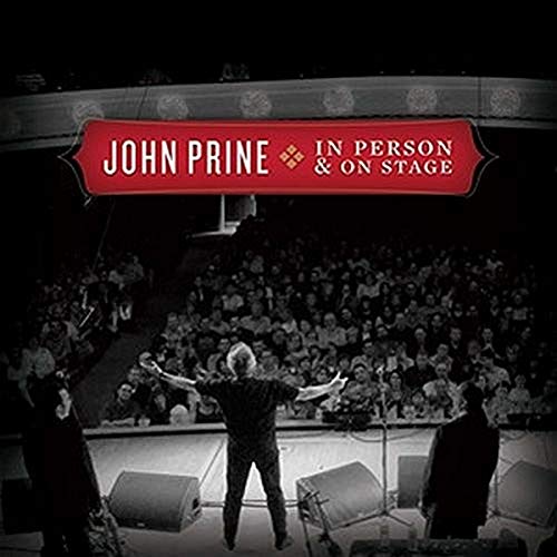 John Prine album cover: a performer with arms raised before a crowd.