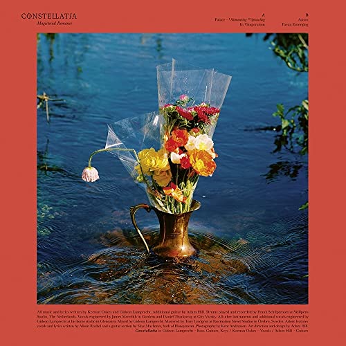 Vinyl album cover: bouquet in a golden urn, surrounded by water.