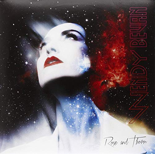 Vinyl record cover featuring a woman’s face amidst stars and red nebula.