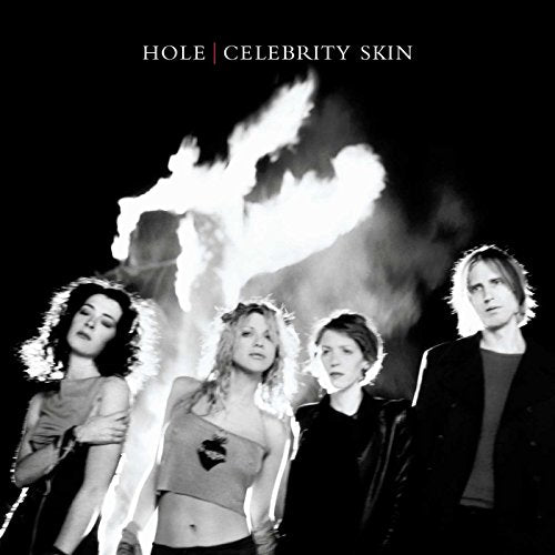 Hole’s “Celebrity Skin” album cover: band members with fiery background.