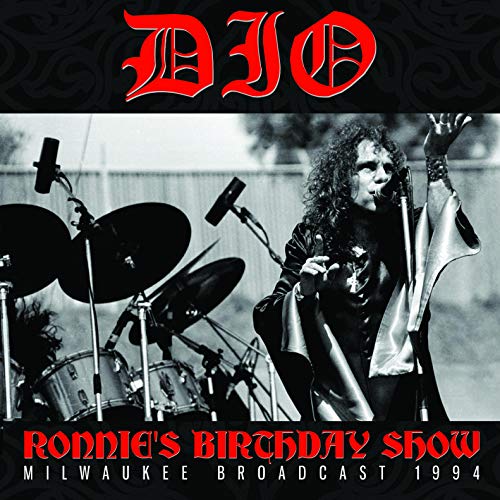 Dio album cover: Ronnie James Dio performing with a microphone and drums.