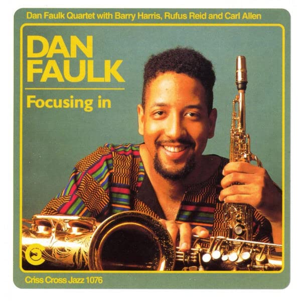CD cover for Dan Faulk's "Focusing In" featuring a smiling musician.
