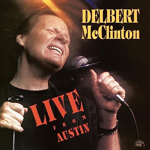 Delbert McClinton singing into a microphone on album cover.